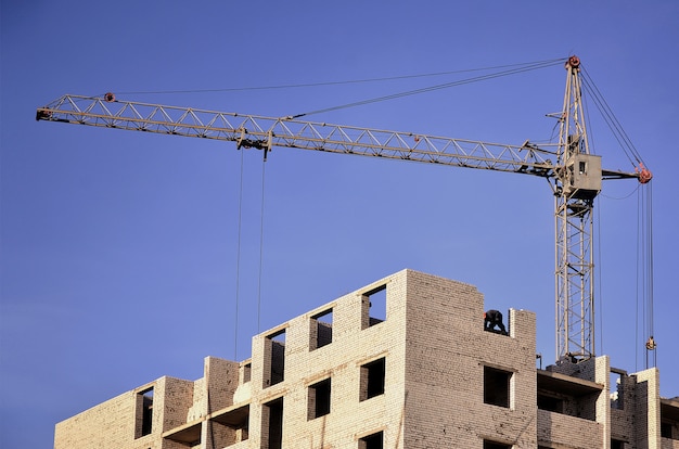 Building under construction with crane