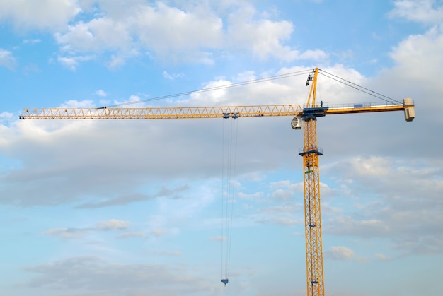 Building crane with the blue sky background