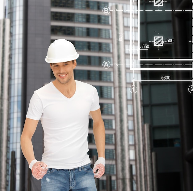 building, developing, consrtuction, architecture concept - handsome builder in white helmet