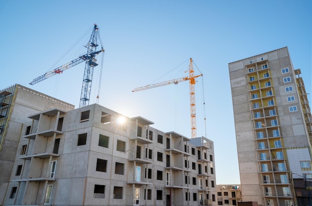 Building house and crane on sky