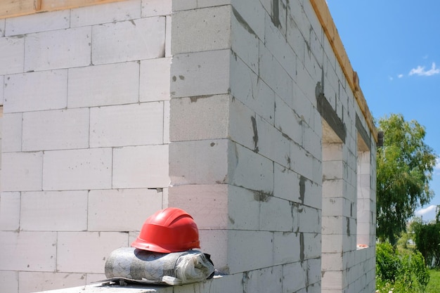 Building a house from white aerated concrete blocks Construction concept