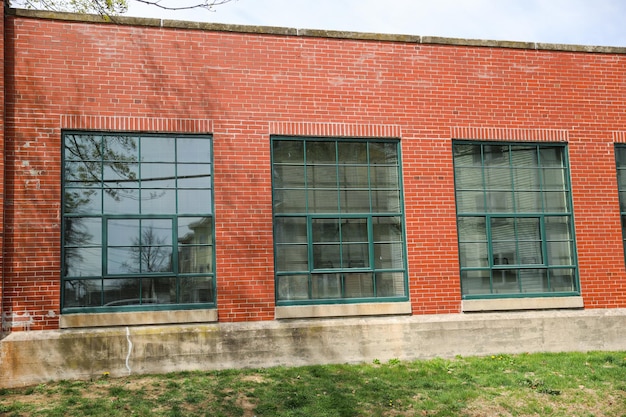 The building is made of brick and has a green window.