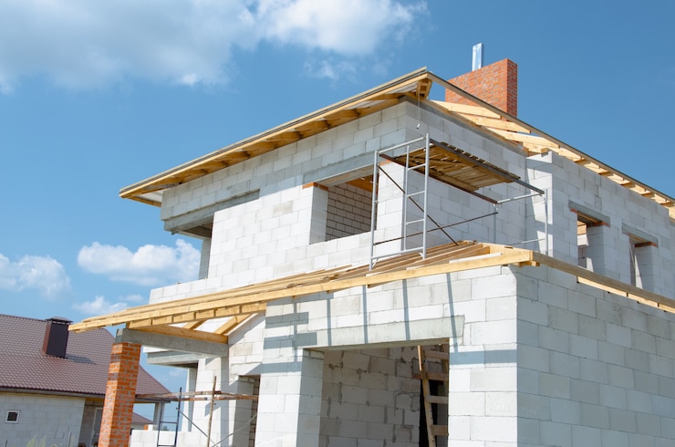 Photo building site of a house under construction made from white foam concrete blocks building new frame
