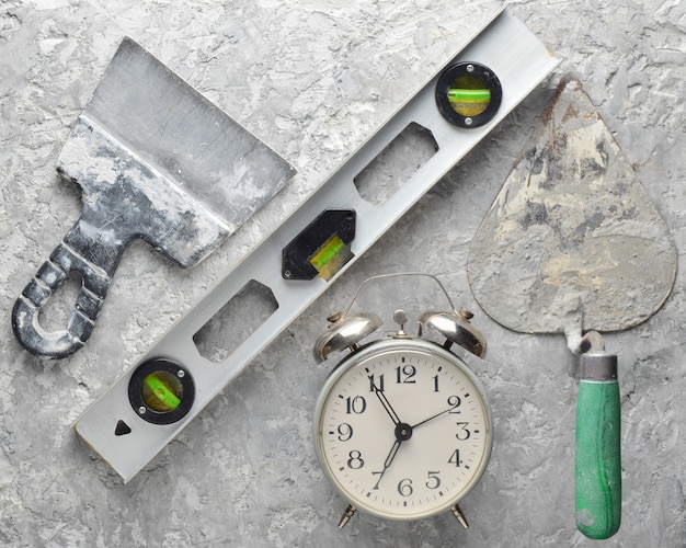 Photo building tools and spatula on concrete