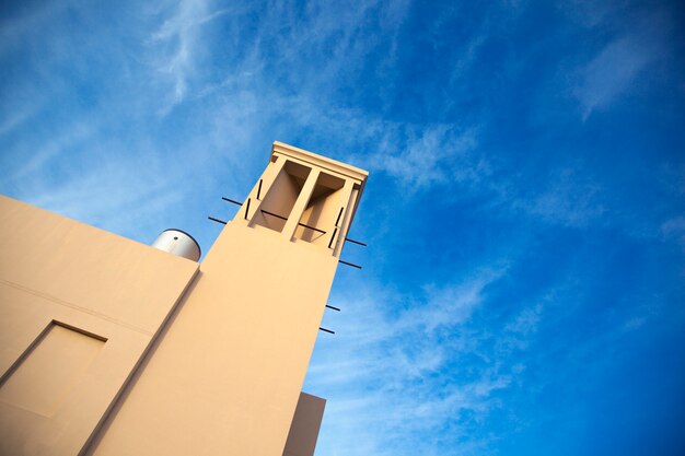 Building tower and cloudy sky