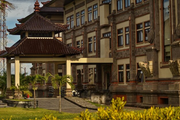 a building with a balcony and a small pool in front of it