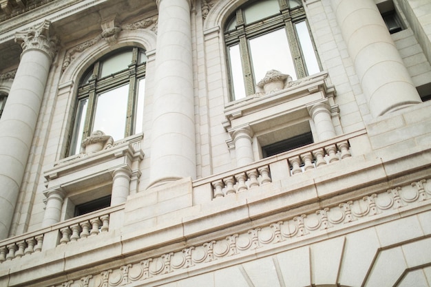 A building with a balcony and a window with the word " the word " on it. "