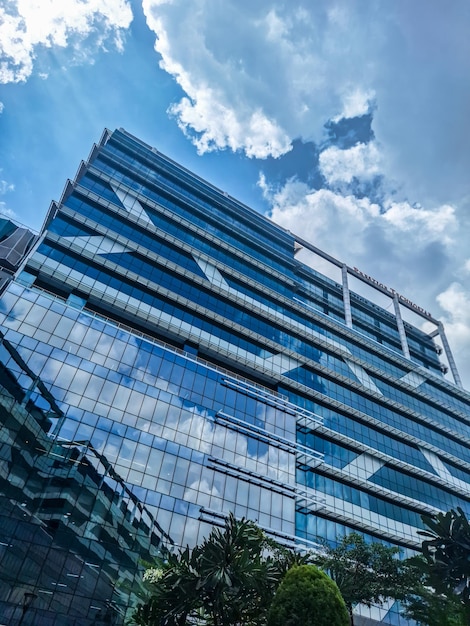 a building with a blue sky and clouds