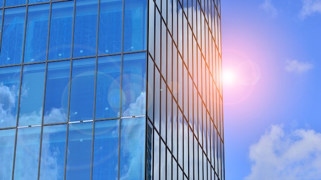 A building with a blue sky and a reflection of a building