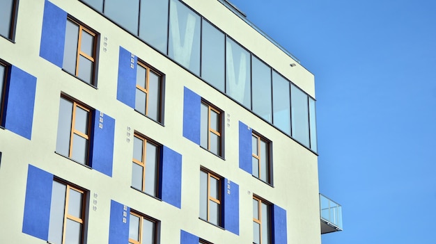 a building with blue windows and a blue awning.