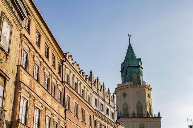 A building with a clock tower in the center of the old town of Lublin