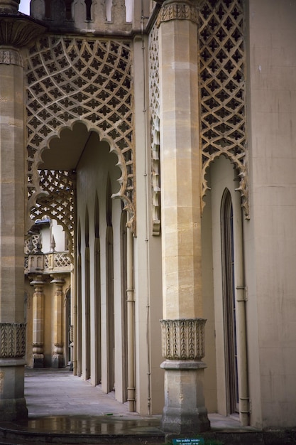 A building with columns and arches with a sign reading " the word " on it ".