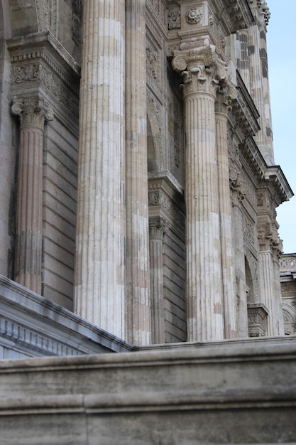 A building with columns and a sign that says " the word " on it.