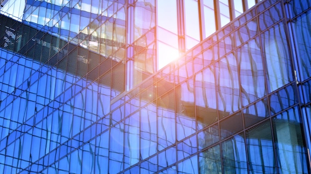 a building with a glass facade and a blue glass wall.