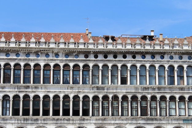 A building with many windows and a red roof