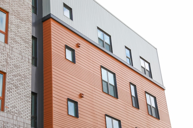 A building with a metal roof that has a window that says " no one " on it.