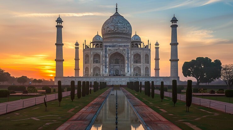 Photo a building with a reflection of a sunset in the water