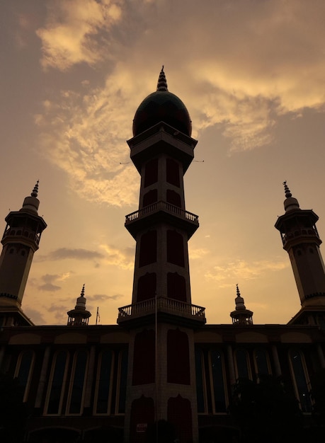 A building with a tower in the background