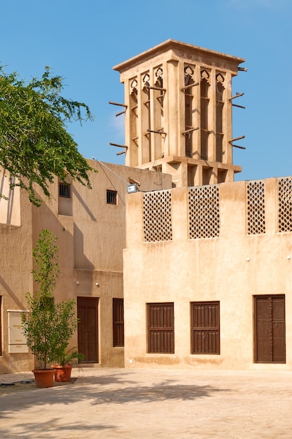 Building with windcatcher in Al Fahidi quarter in Old Dubai, United Arab Emirates (UAE)