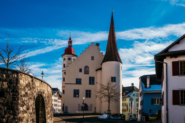 Buildings against blue sky and clouds