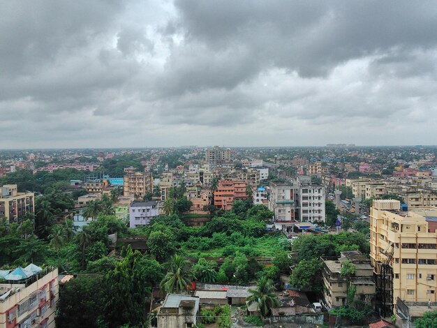 Buildings against cloudy sky