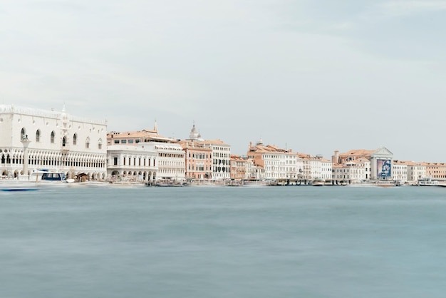 Buildings by grand canal against sky in city