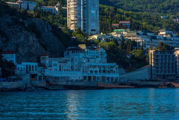 Buildings by river in city