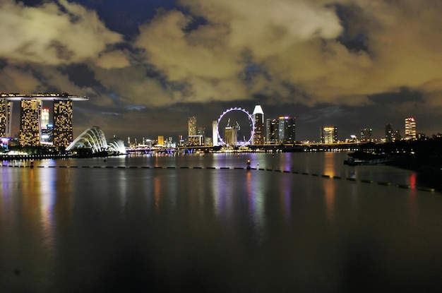 buildings by river at night