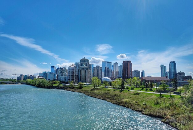 Buildings in city against blue sky