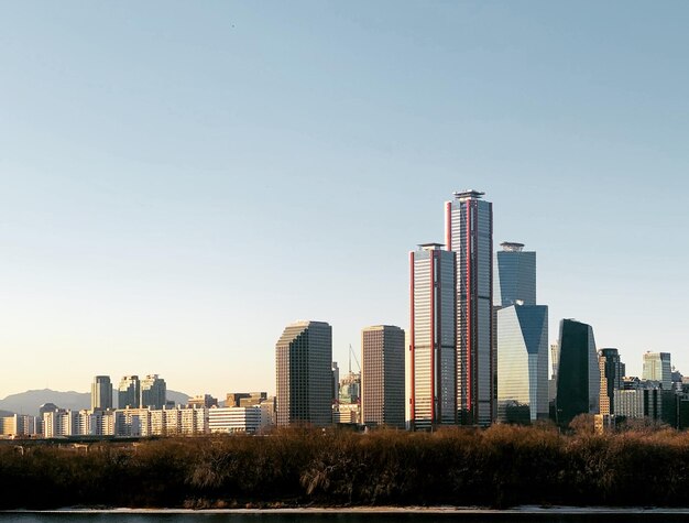 Photo buildings in city against clear sky