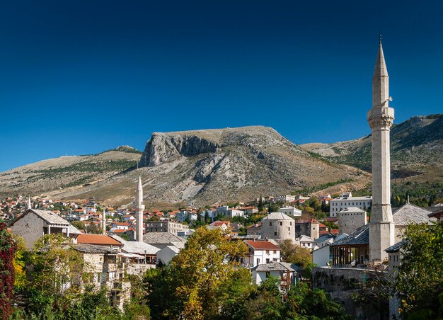 Buildings in city against clear sky