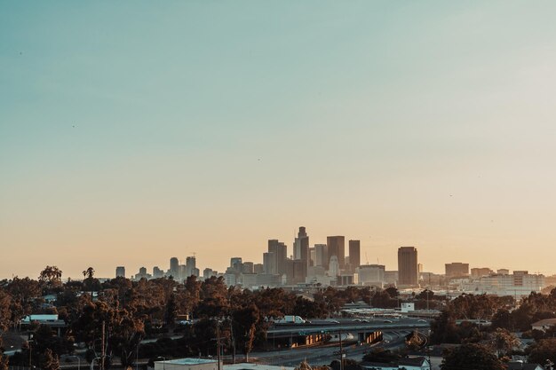 Photo buildings in city against clear sky