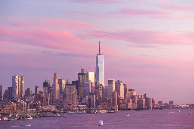 Buildings in city against sky during sunset