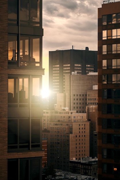 Photo buildings in city against sky during sunset