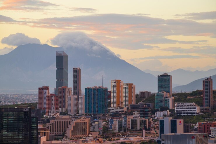 Photo buildings in city against sky during sunset