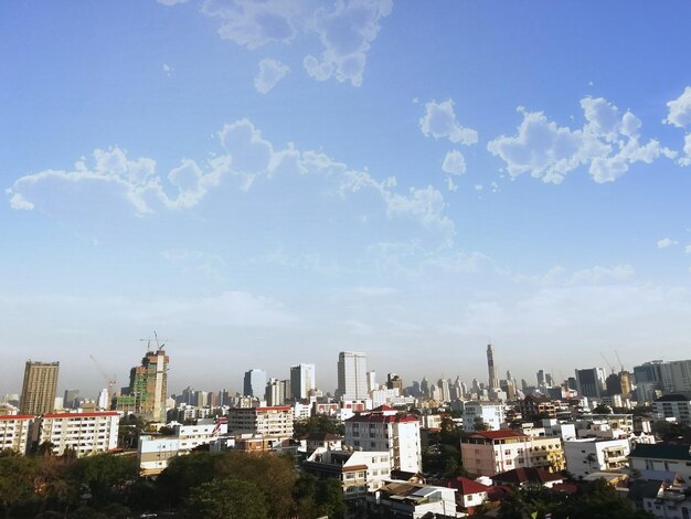 Buildings in city against sky