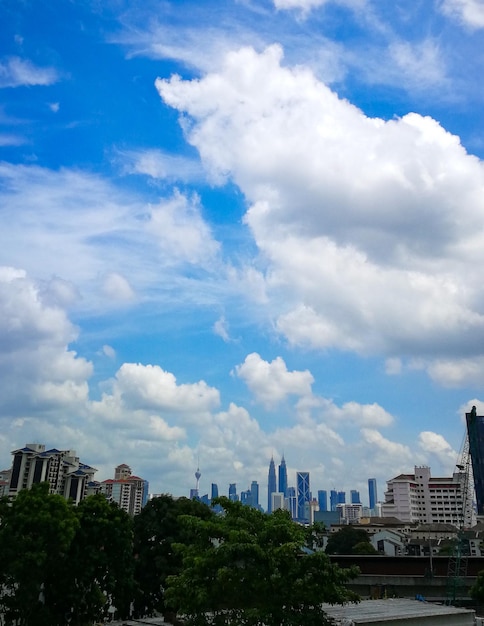 Buildings in city against sky