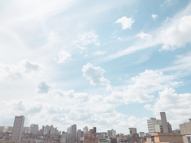 Photo buildings in city against sky