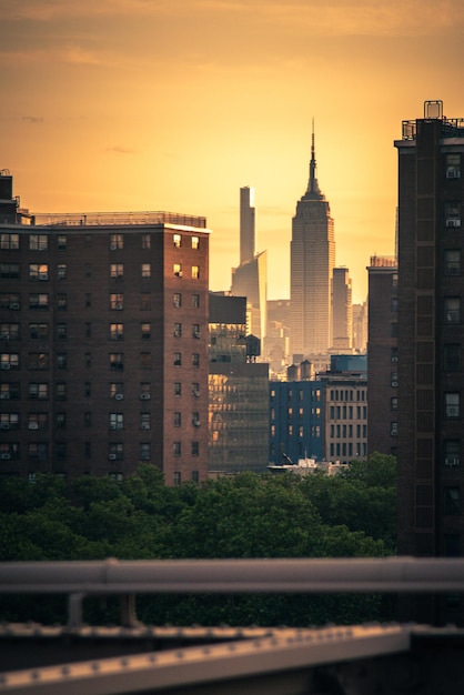 Buildings in city during sunset