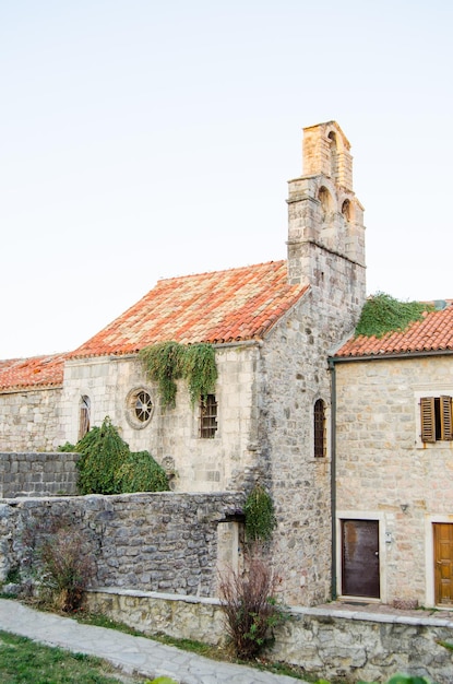 The buildings of the old town are made of stone with a red tiled roof