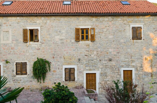 The buildings of the old town are made of stone with a red tiled roof