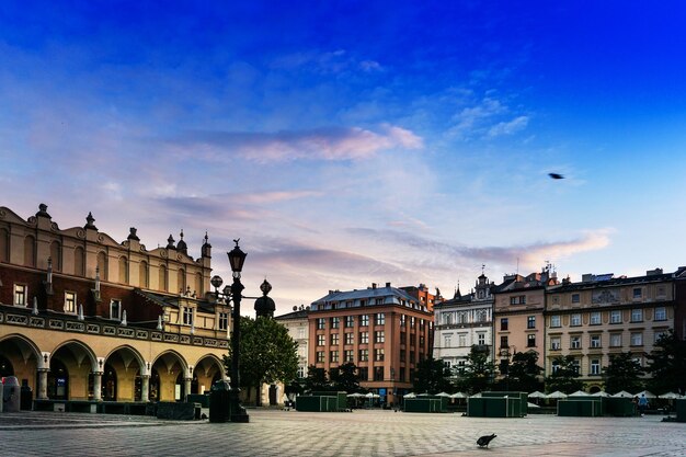 Buildings in town against blue sky