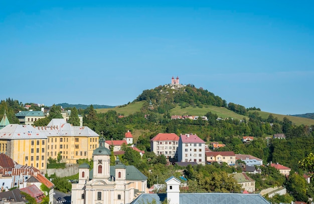 Buildings in town against clear blue sky