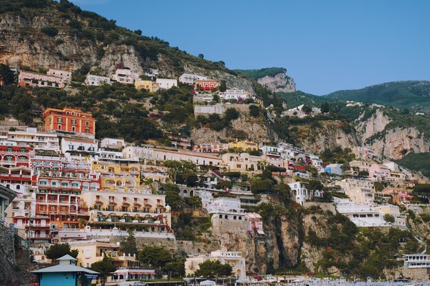 Buildings in town against clear sky