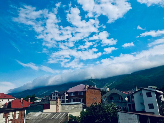 Buildings in town against sky