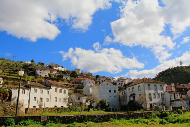 Buildings in town against sky