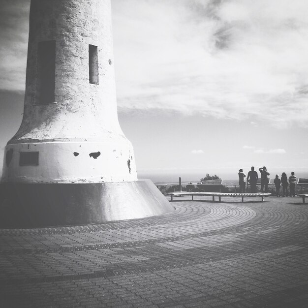 Photo built structure against cloudy sky