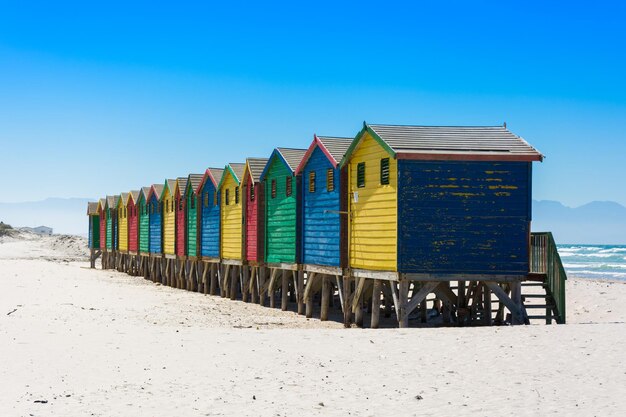 Built structure on beach against clear blue sky