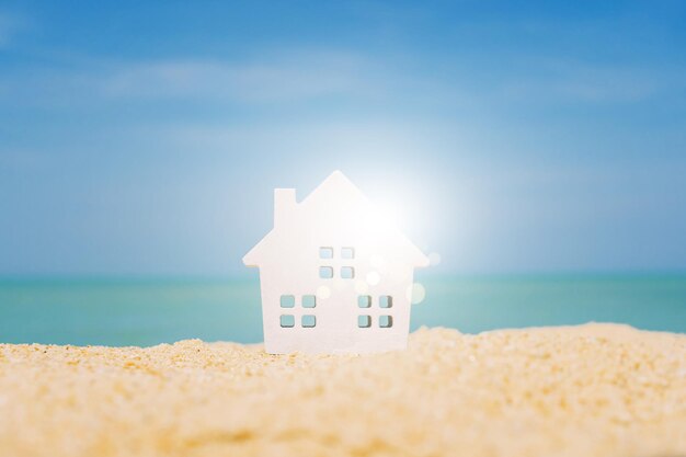 Built structure on beach by sea against sky