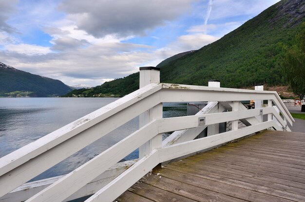 Built structure by lake against sky